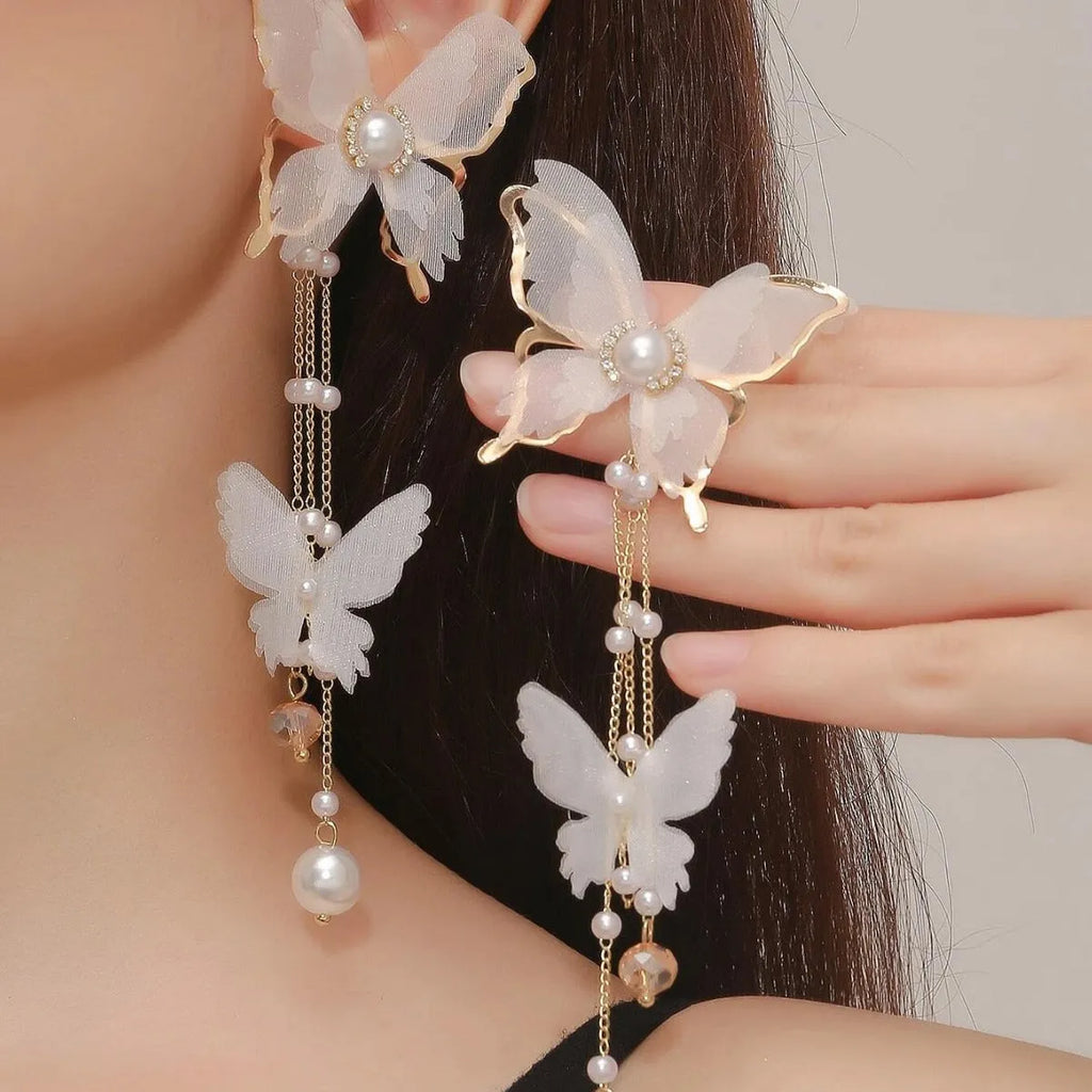 White butterfly earrings with tassel lace pearls and rhinestone decorations on copper alloy