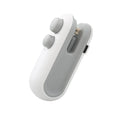 Blue and white handheld USB rechargeable food sealer with magnetic back and cutter blade.