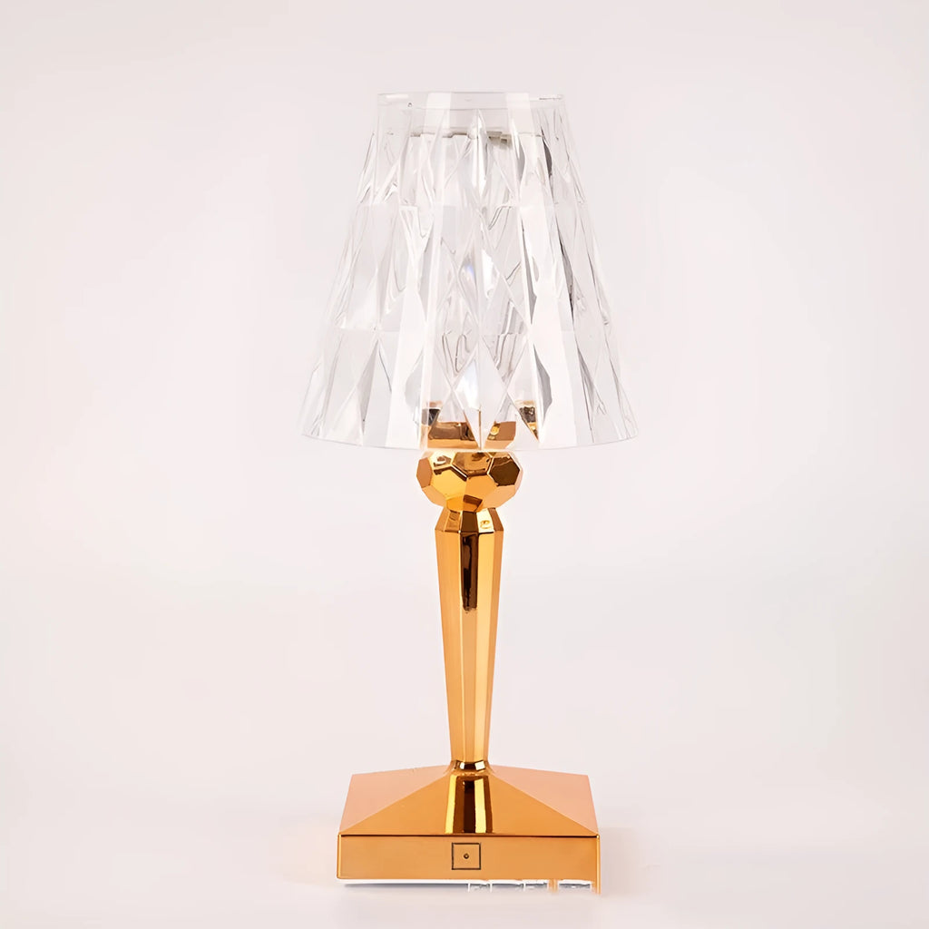 Rose gold portable touch night light with dimmable colours on a table.