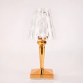 Rose gold portable touch night light with dimmable colours on a table.