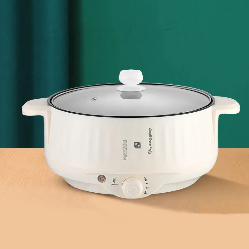 Electric hot pot with non-stick interior and integrated heating element in white or green finish