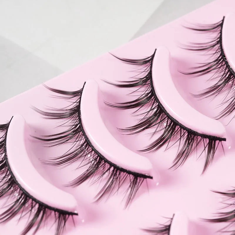Set of five pairs of black wispy manga-style false eyelashes for anime cosplay and Korean makeup.