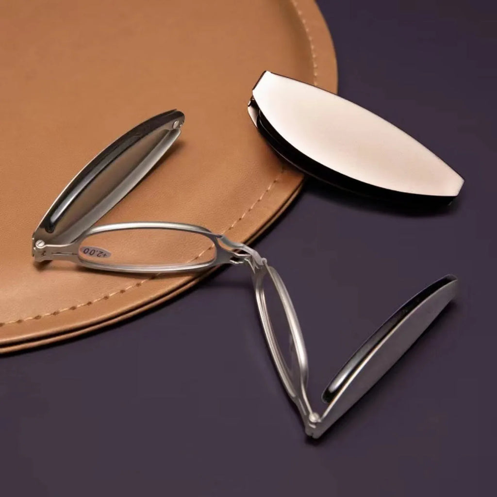 Black folding presbyopic reading glasses with round retro lenses, shown in open and closed positions.