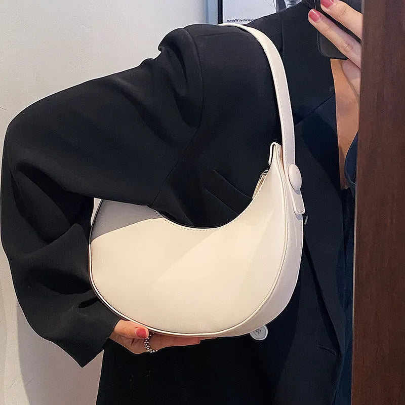 Retro dumpling-shaped women's shoulder bag in PU leather with sandwich pocket exterior