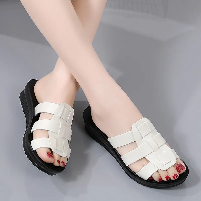 Beige women's flat-bottom slippers with a PU leather toe and soft sole.