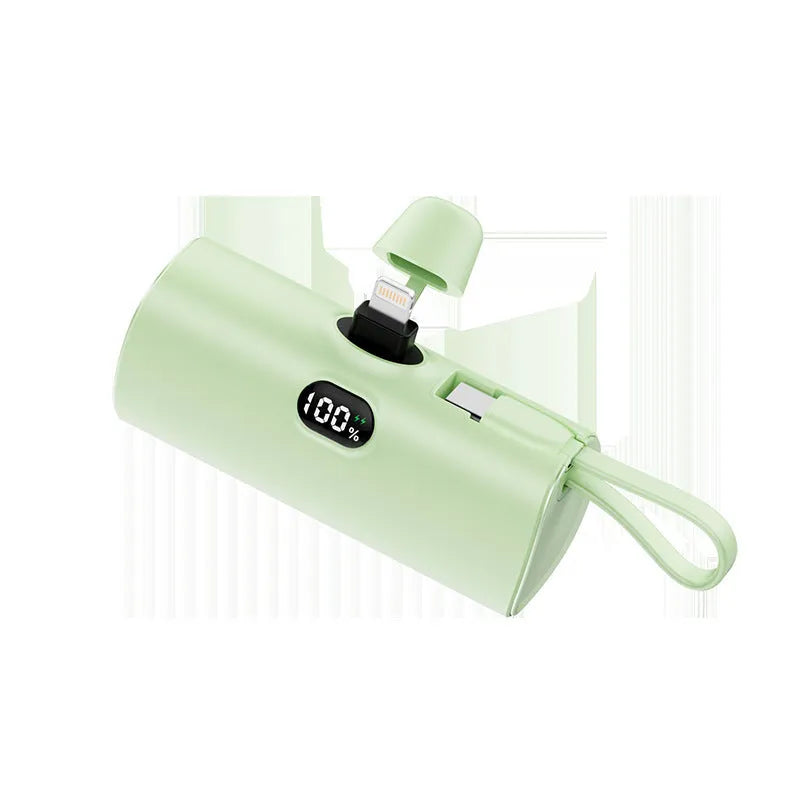 Compact rectangular power bank with digital display, showing colour options: black, white, pink, blue, green.