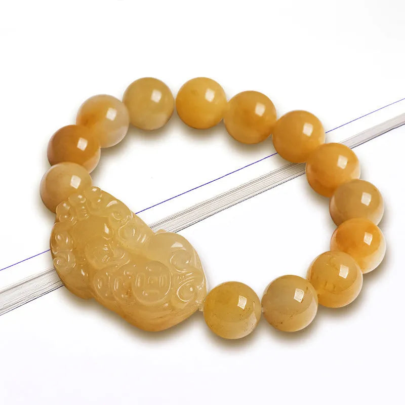 Carved Jinsi Jade money bracelet showing golden thread patterns in natural stone