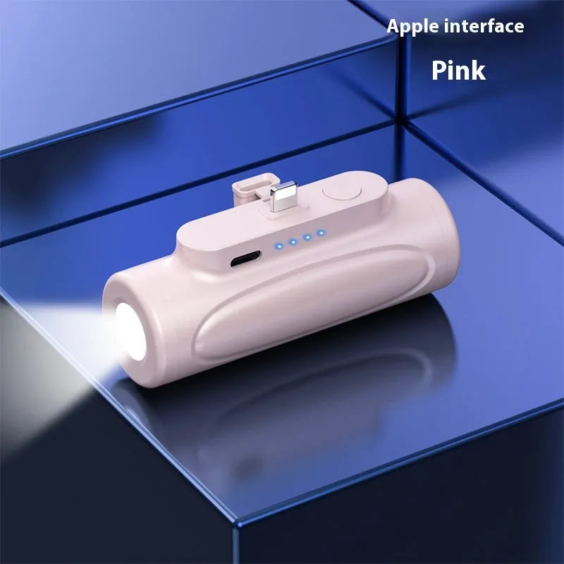 Black and pink creative power bank with integrated LED flashlight glare, showing Type-C and Apple port options.
