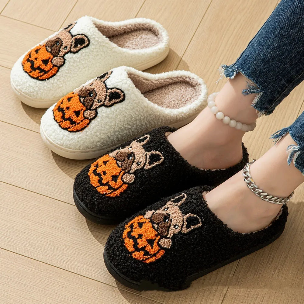 Halloween pumpkin slippers in black or white with plush material and rubber soles