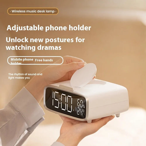 White Bluetooth speaker with integrated wireless charging pad and night light function