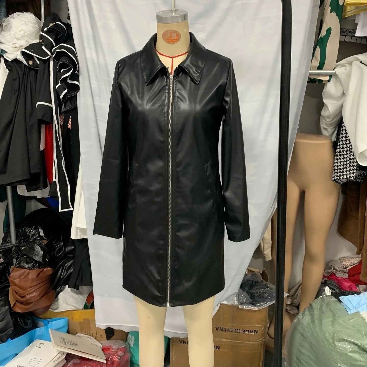 Black women's leather jacket with solid colour and long sleeves