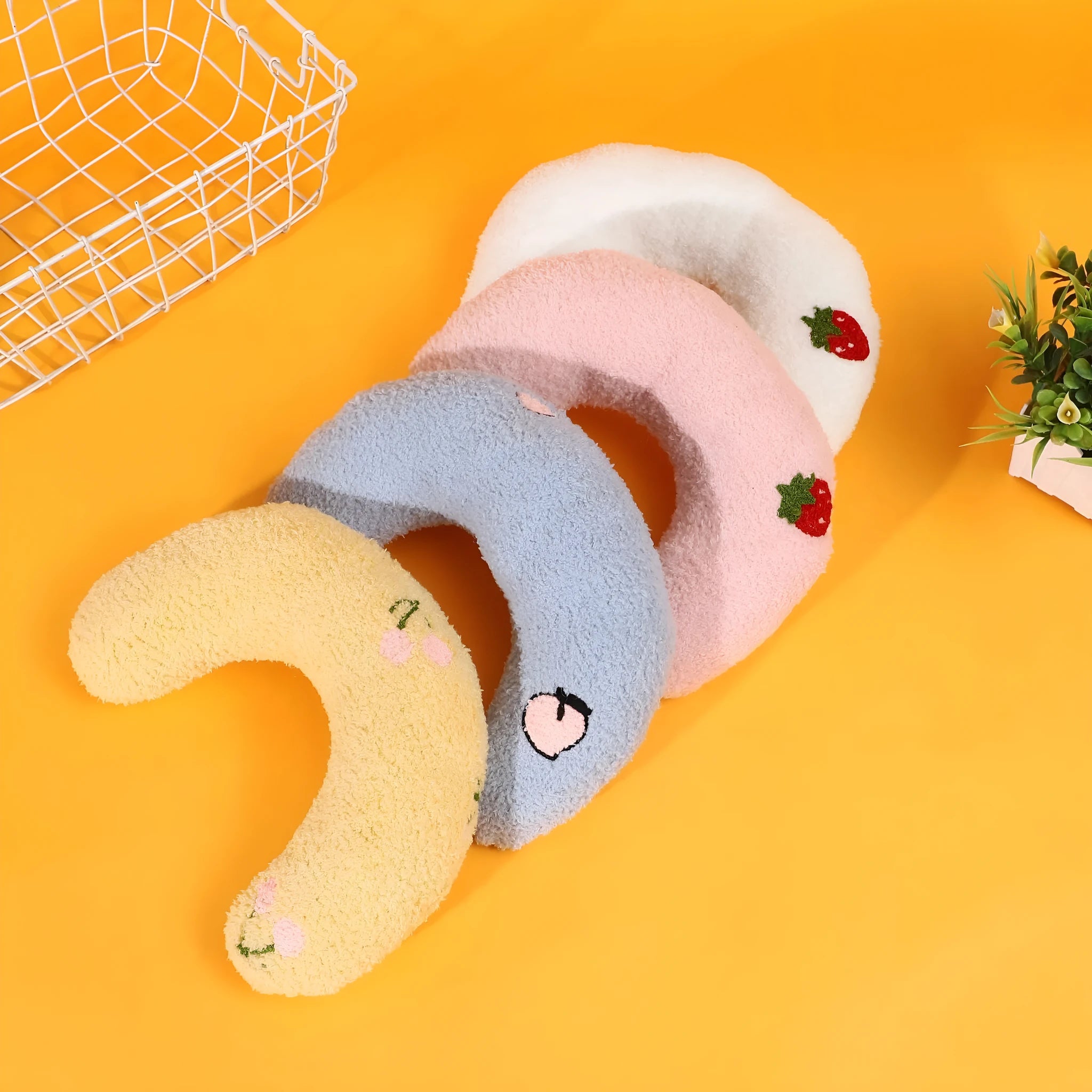 Half moon U-shaped cloth pillow for dogs and cats in blue, pink, white, or yellow