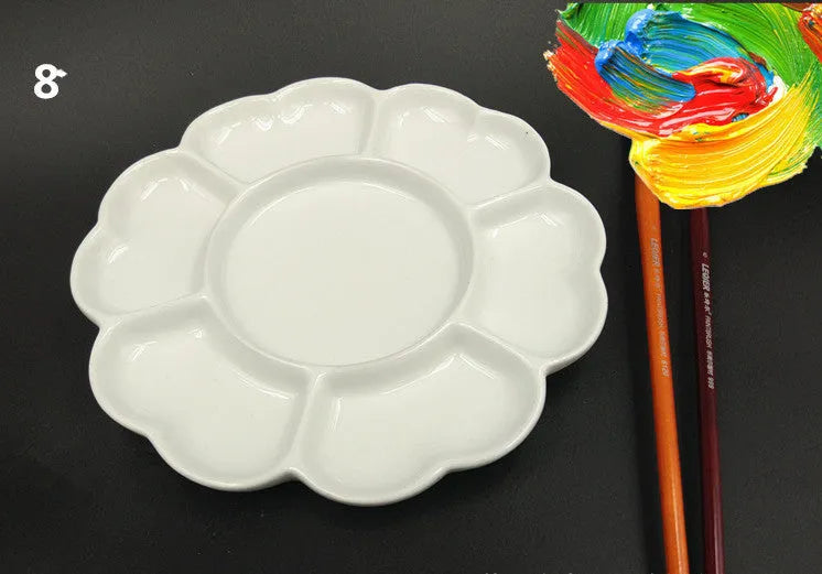 White ceramic plum blossom shaped artist's palette for paint mixing