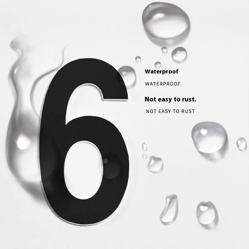 Black stainless steel adhesive house number plate, 7.5cm tall, with separate letters and numbers.