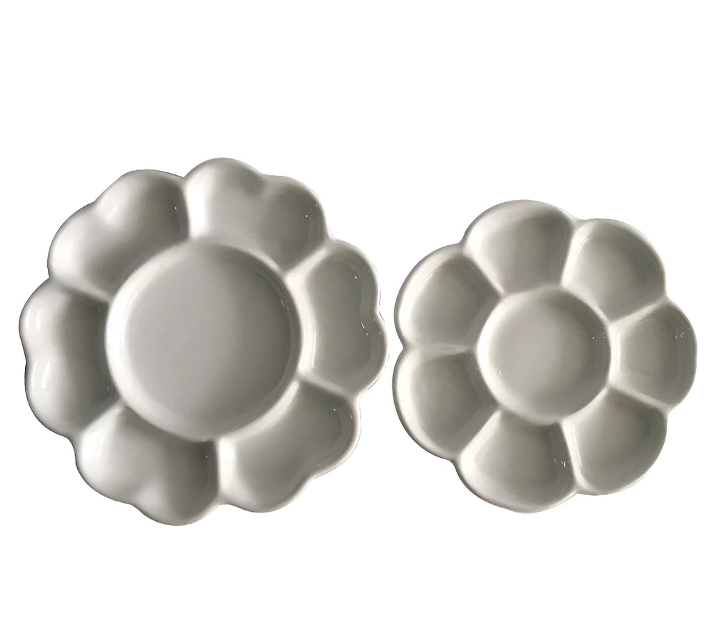 White ceramic plum blossom shaped artist's palette for paint mixing
