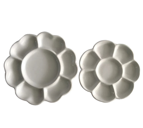 White ceramic plum blossom shaped artist's palette for paint mixing