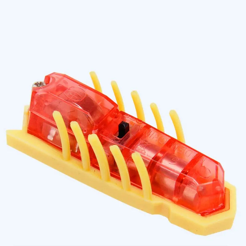 Red mini electric ladybug cat toy with 12 legs, shown on a flat surface.