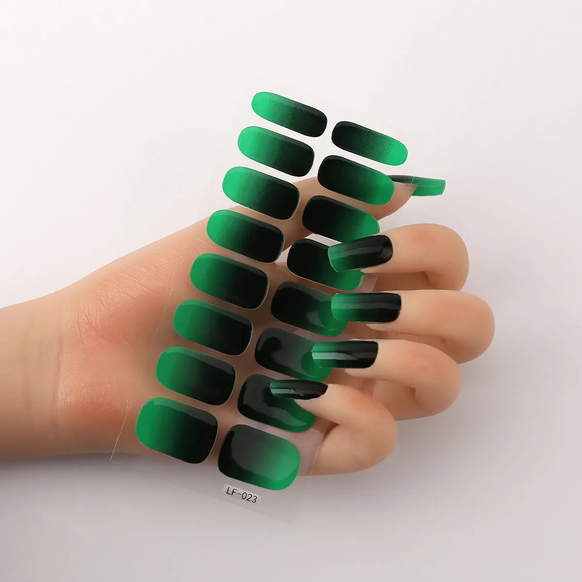 Sheet of 16 solid colour nail art sticker designs including cross, rose, and leopard print patterns.