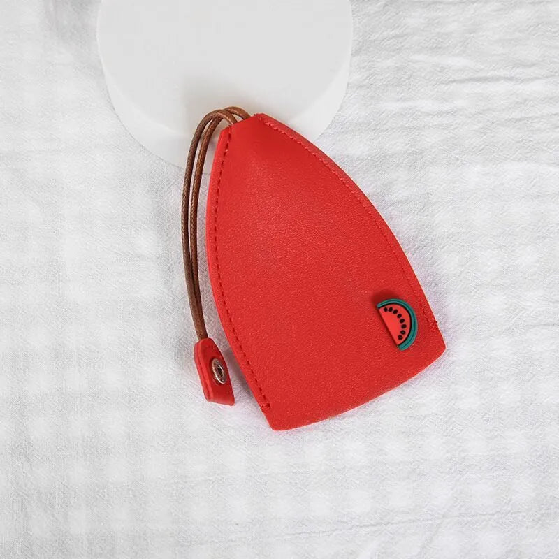 Cartoon pull-out car key case in PU leather with colourful designs measuring 14 x 7.5 cm