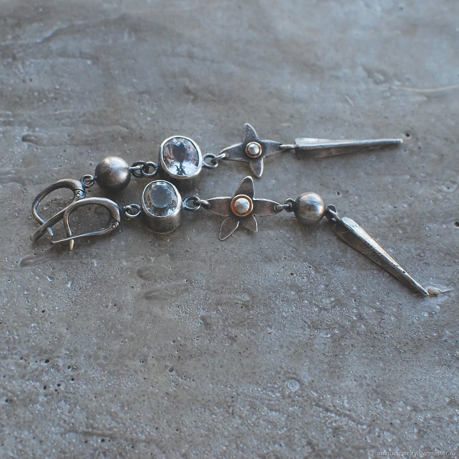 Pair of Hesheng geometric long drop earrings with antique silver XINGX pendant and rhinestones.