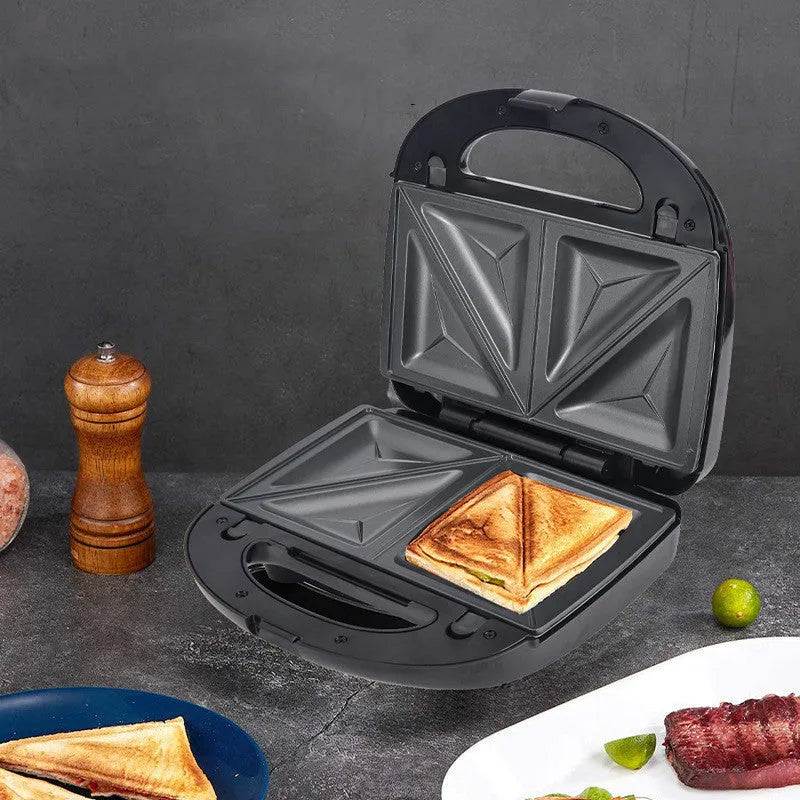 Black electric sandwich pan with double-sided heating, exchangeable plates, and brushed stainless steel cover