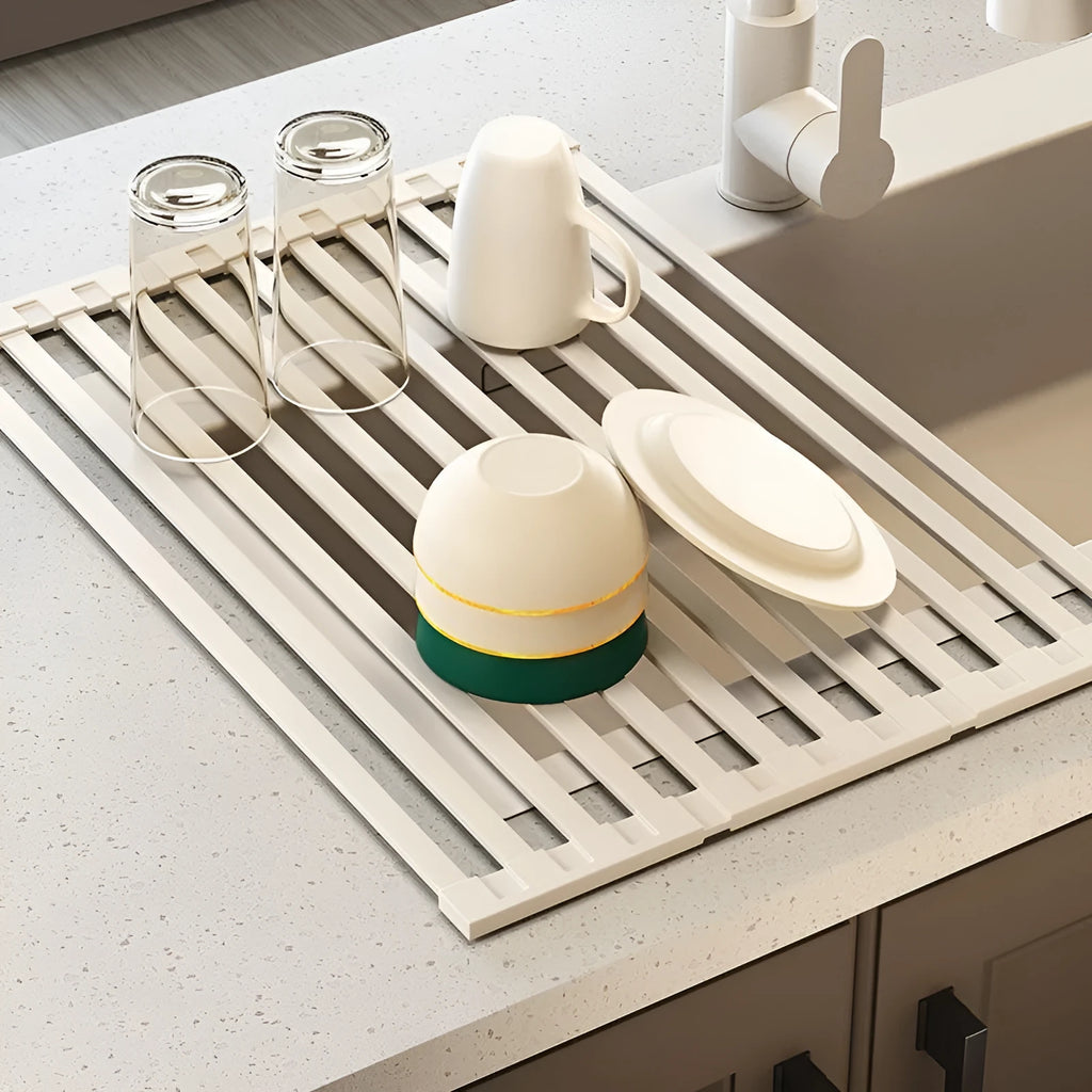 Foldable stainless steel kitchen draining rack in milky white finish showing tri-fold mechanism