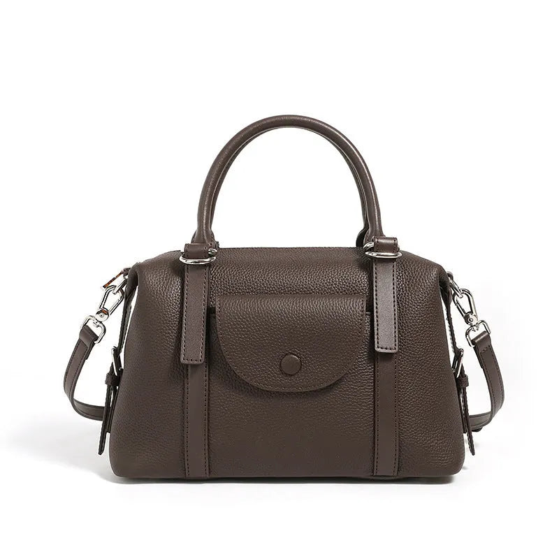 Genuine leather ladies handbag in black, brown, or elephant grey with contrast stitching and a lock.
