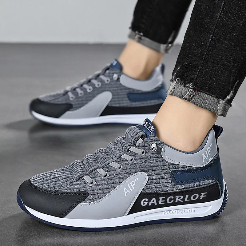 Men's grey mesh running shoes with lace-up closure and round toe design