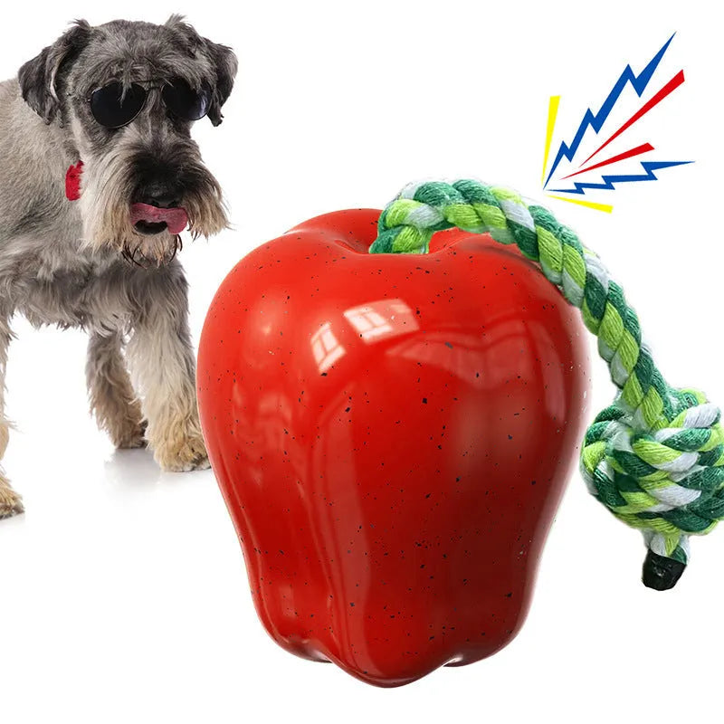 Plastic dog dental toy with dropping ball design for molar cleaning in green and red colours