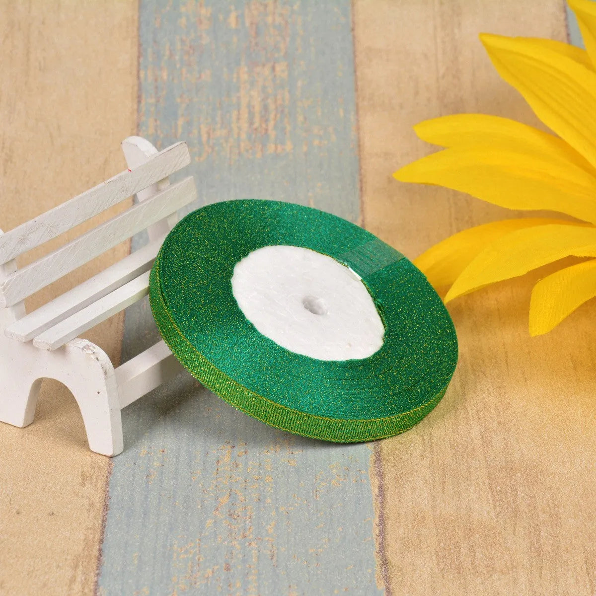 Polyester ribbon spool in metallic colours for decorative clothing and gift packaging trim