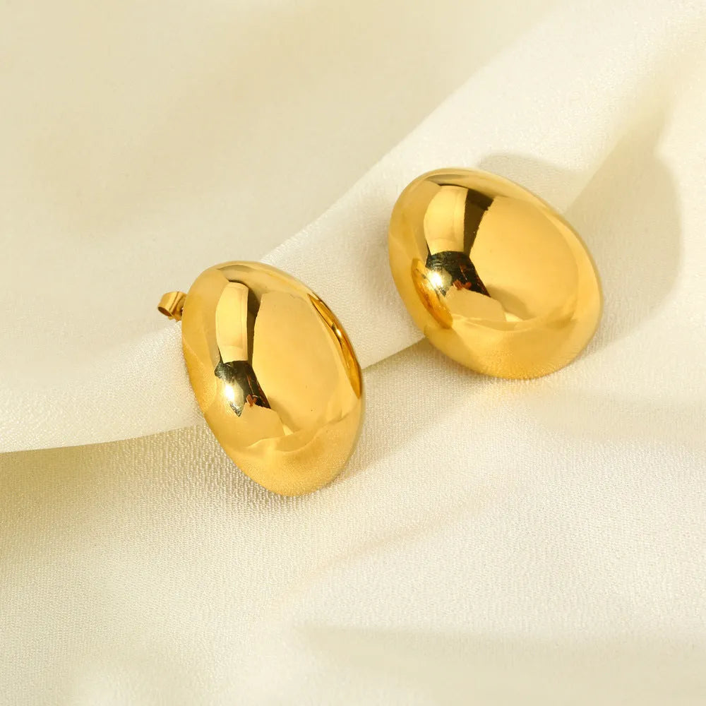 Geometric stainless steel ear studs with exaggerated glazed surface in DFE139 colour
