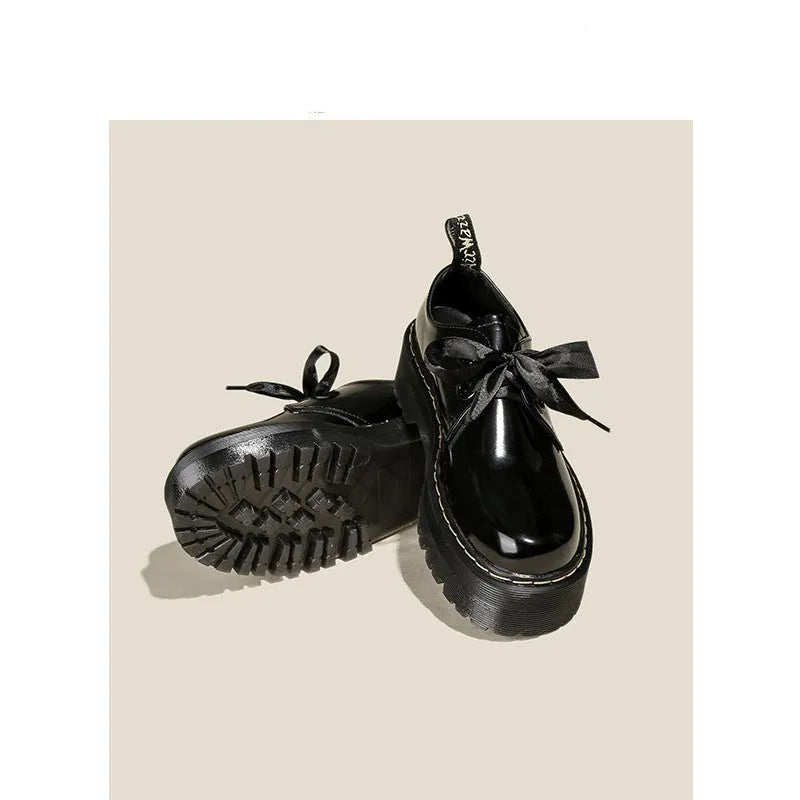 Women's white thick-soled lace-up shoes with ribbon and cross-strap details on a superfine fibre upper.