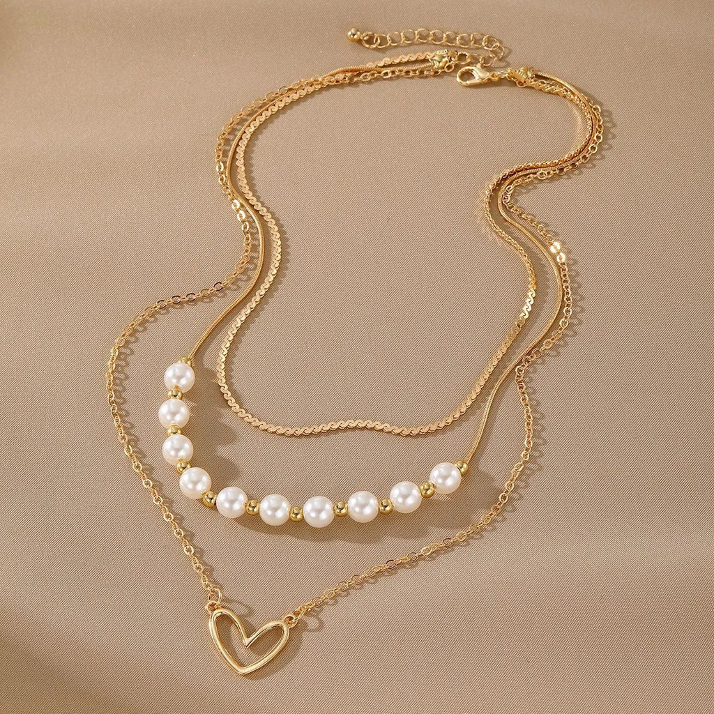 Vintage heart-shaped alloy necklace with pearl chain and electroplated gold finish