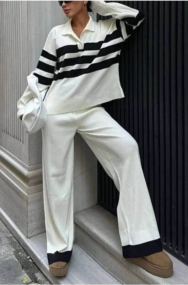 Women's black knitted two-piece set with polo collar shirt and striped matching trousers