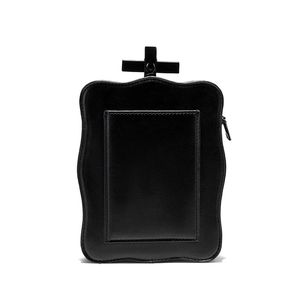 Black gothic skull crossbody bag with square shape, stitching and metal rivet detailing