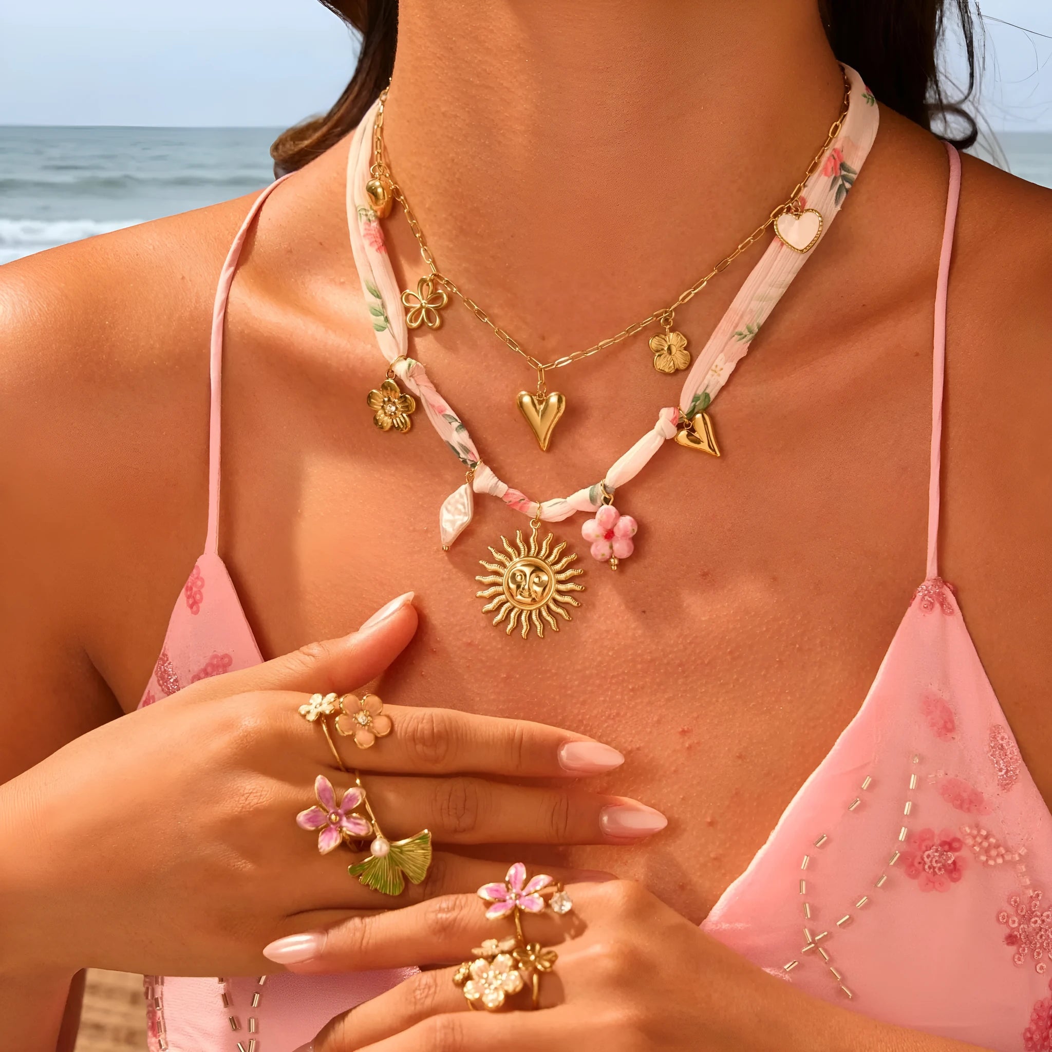 Stainless steel geometric sun pendant necklace with 18K gold electroplated finish on 41-50cm chain