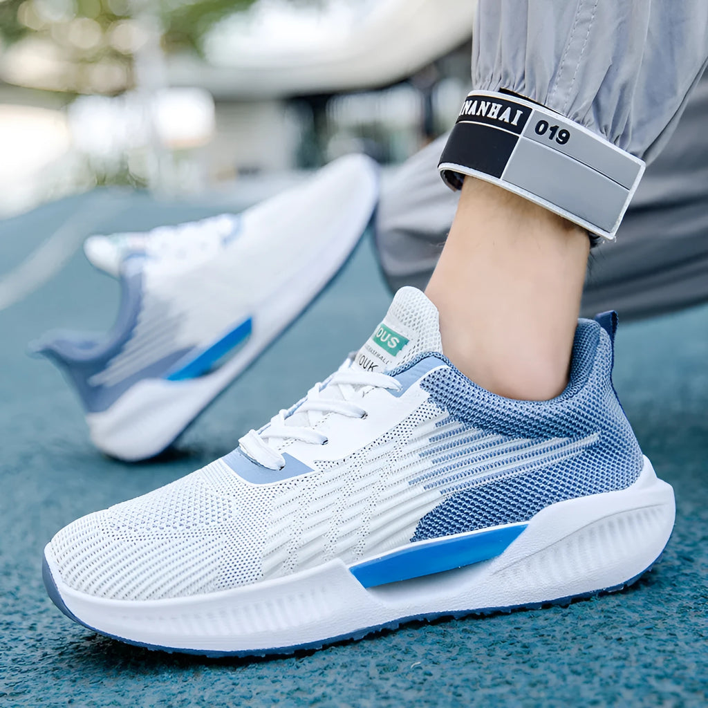 Men's blue casual mesh shoes with round toe and injection moulded sole on a white background.