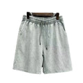 Men's cotton shorts with distressed detailing in straight-leg loose fit casual style