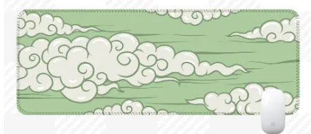 Large natural rubber desk mat with Japanese cloud pattern on a wooden desk, showing non-slip base.