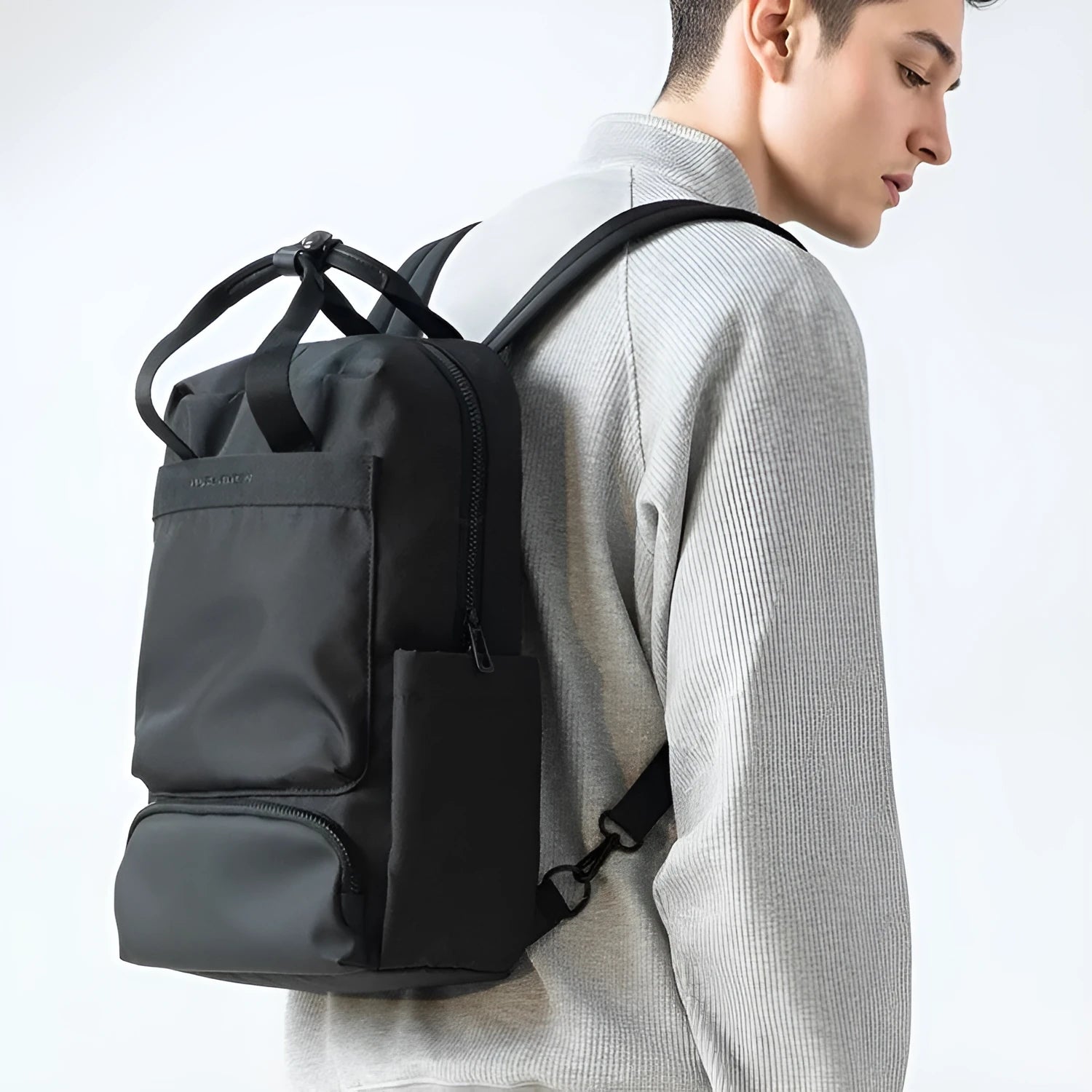 Front view of lightweight black Oxford cloth computer backpack with 20-35L capacity