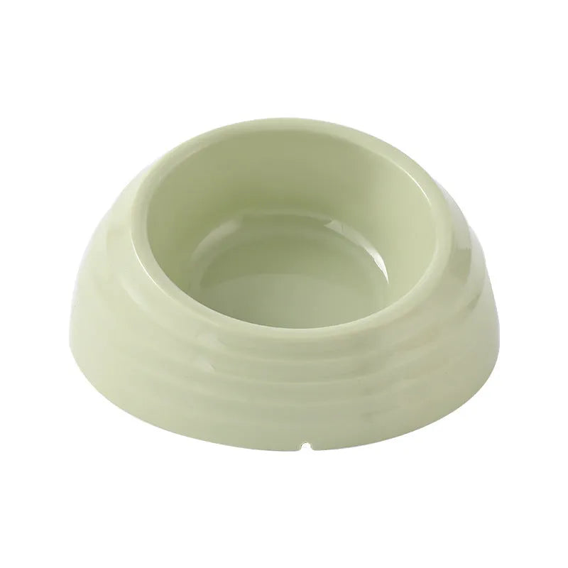 Stainless steel cat bowl on a plastic base in beige, brown, or light green.