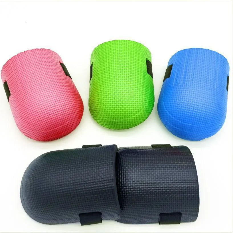 A pair of thick EVA foam kneepads for construction and auto repair work.