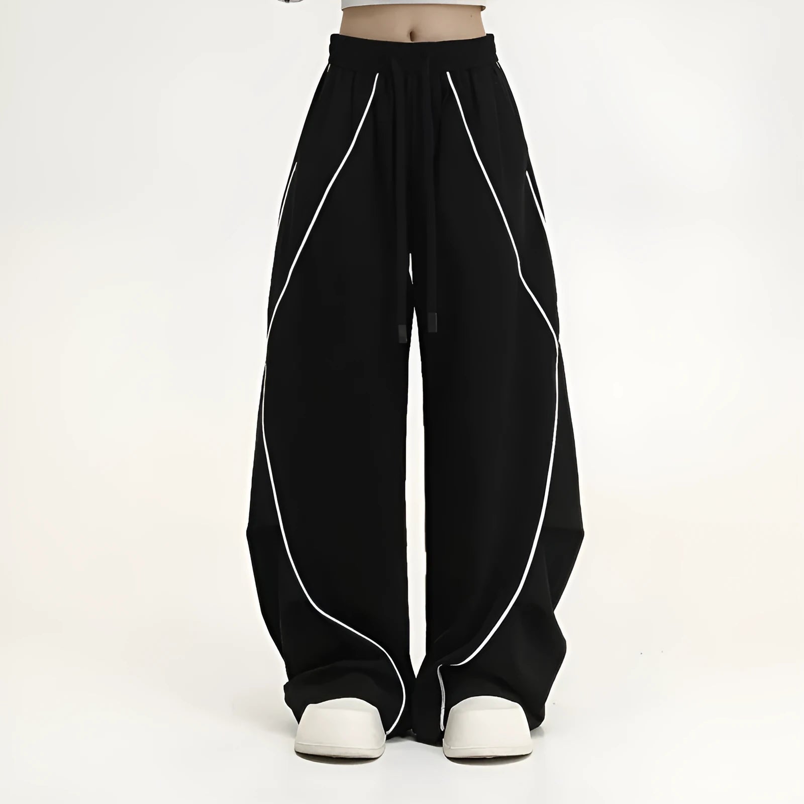 Black pleated hip hop wide-leg pants with stripe pattern showing mid-waist and loose fit