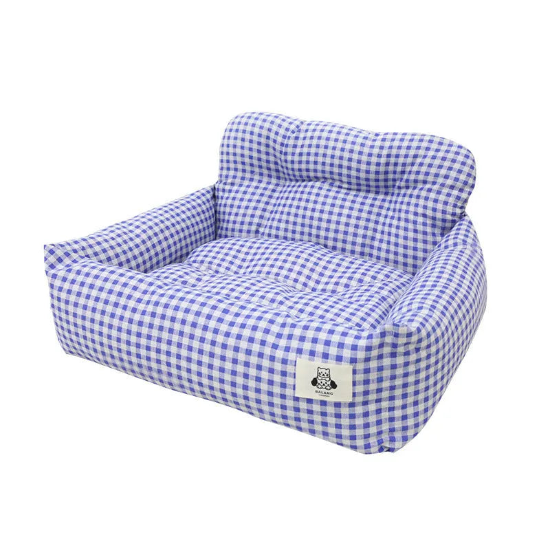 Grey and blue plaid cloth dog travel nest for use in a car, shown in two size options.