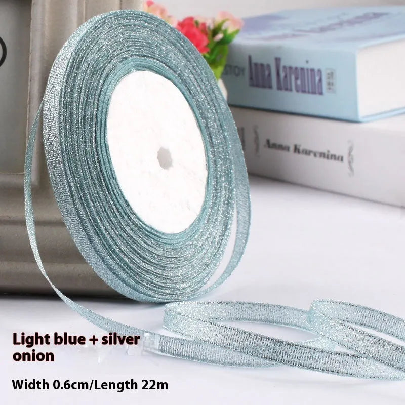 Roll of polyester gift ribbon showing 0.6cm width and multiple colour options including metallic finishes