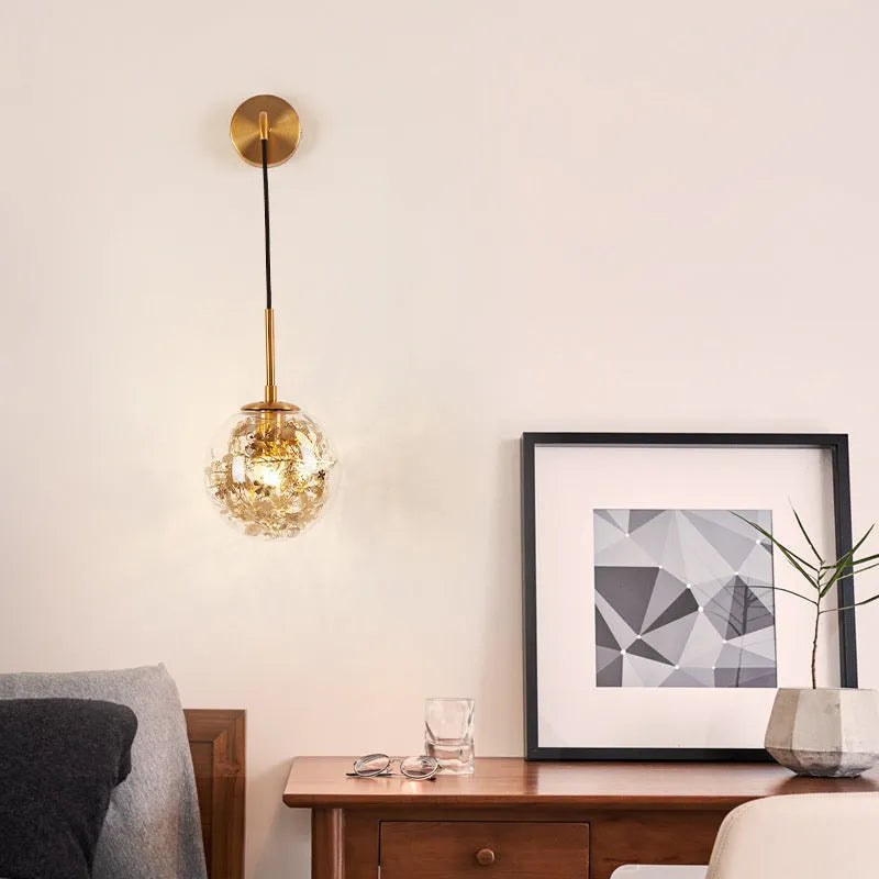 Modern glass wall lamp in golden flower or silver flower finish, shown in 15cm and 20cm sizes