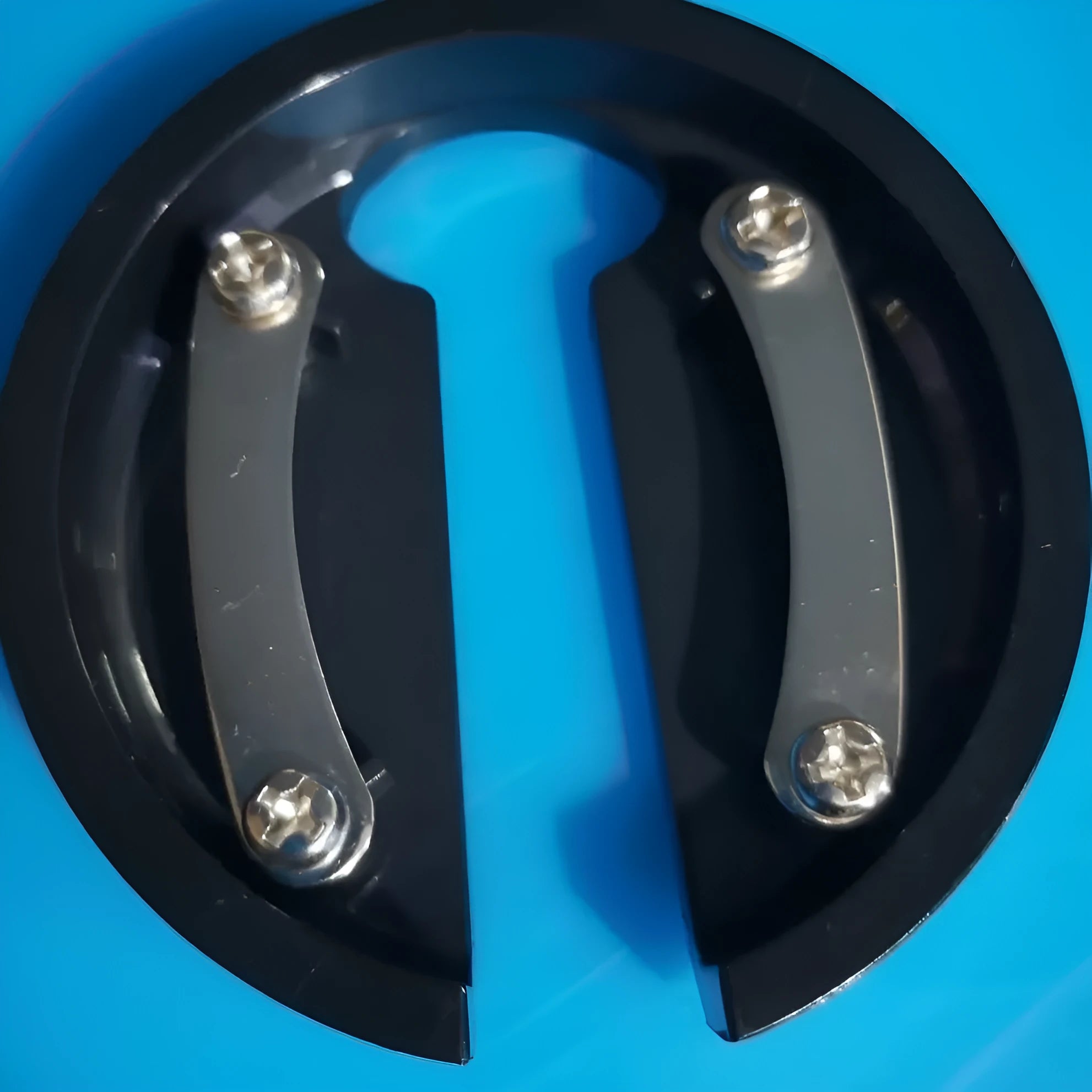 Stainless steel manual kitchen tool combining a bottle opener and paper cutter