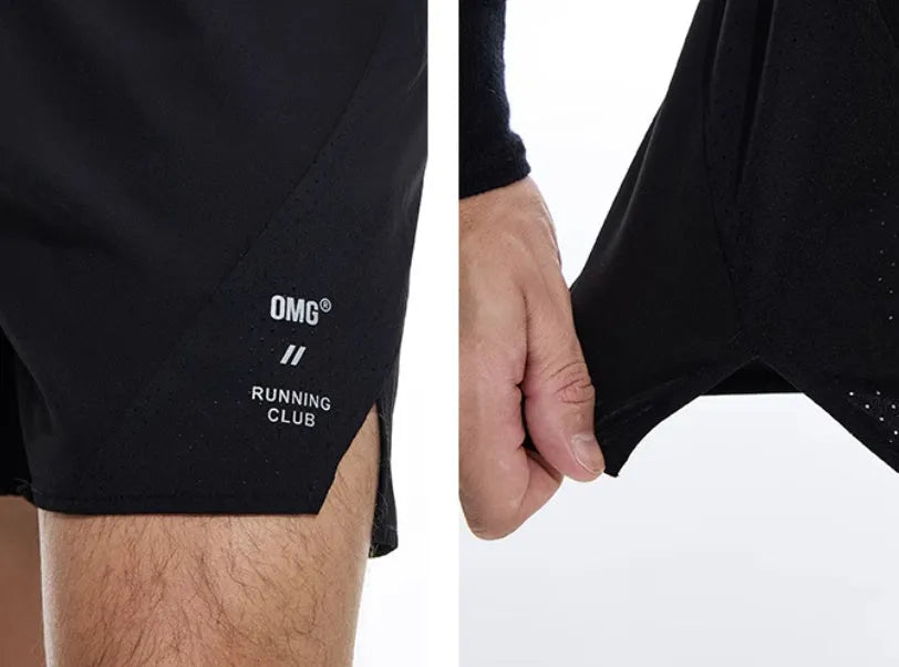 Men's black running shorts with laser stitching detail on a grey background