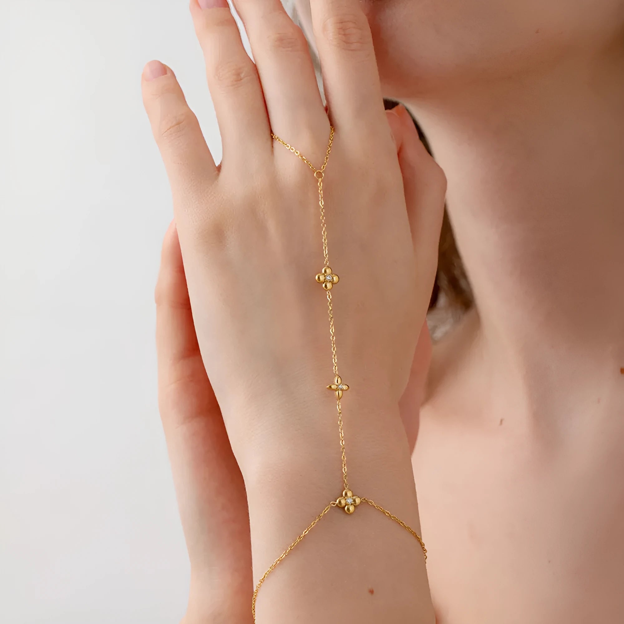 Gold stainless steel bracelet with geometric flower and octagonal star design