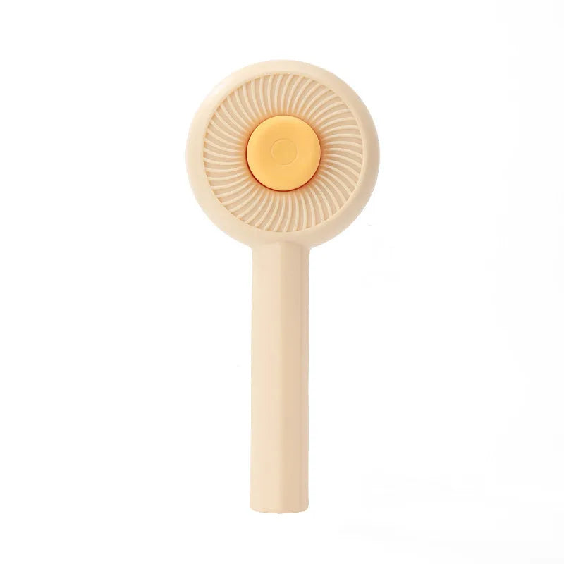 Blue self-cleaning pet grooming brush with angled metal needles and a yellow button.